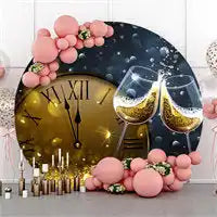 Decorative clock display with champagne glasses, pink balloons and gold candles for New Year’s celebration.