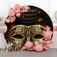 Elegant black and gold masquerade mask decorated with pink floral accents and ornate swirls.