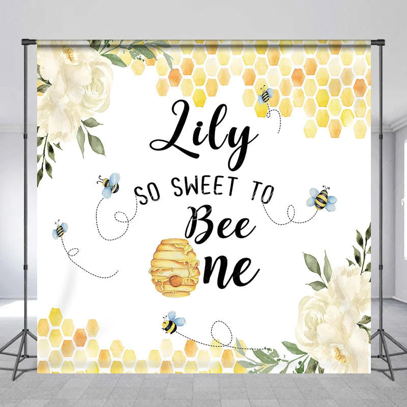 Lofaris Custom Bee and Honeycomb First Birthday Backdrop Personalized So Sweet to Be One with White Flowers