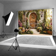 Lofaris Enchanted Garden Photography Backdrop with Rustic Wooden Door Lush Greenery and Colorful Flowers for Spring Portraits