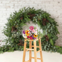 Lofaris Green Evergreen Wreath and Pinecone Holiday Backdrop Rustic Winter Christmas Party Decor on White Brick Wall
