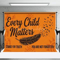 Lofaris Orange and Black Every Child Matters Holiday Backdrop featuring a feather flying birds footprints
