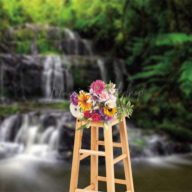 Lofaris Waterfall Scene Luxuriant Green Vegetation Backdrop