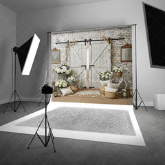 Lofaris White Brick Wall and Rustic Barn Doors Photography Backdrop with Elegant Floral Arrangements Wedding Event Decor