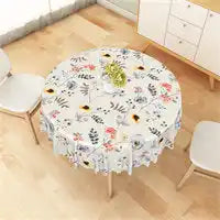 Round tablecloth with a floral and botanical print pattern.