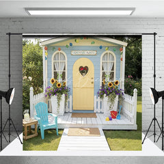 Lofaris Blue Playhouse Photography Backdrop with Yellow Heart Door Sunflowers and Adventure Awaits Sign for Kids Party