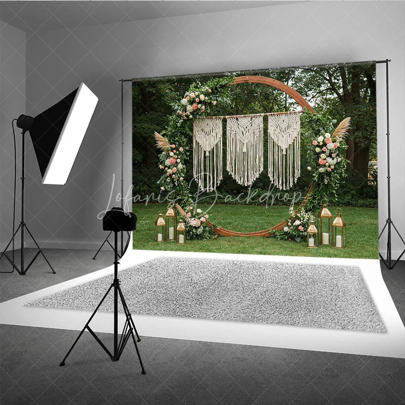 Lofaris Boho Macrame Floral Greenery Arch Photography Backdrop with Lanterns for Wedding Ceremony and Outdoor Event Decor