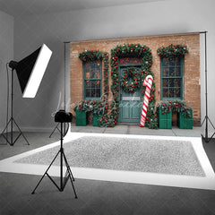 Lofaris Christmas Storefront Backdrop Brick Wall with Giant Candy Cane Green Door Wreaths Holiday Photo Props