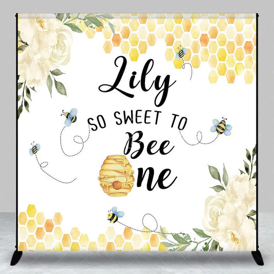 Lofaris Custom Bee and Honeycomb First Birthday Backdrop Personalized So Sweet to Be One with White Flowers