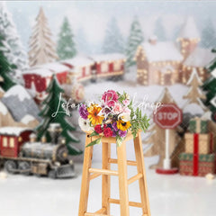Lofaris Festive Winter Village Holiday Backdrop with Miniature Train Snow Covered Trees and Gift Boxes
