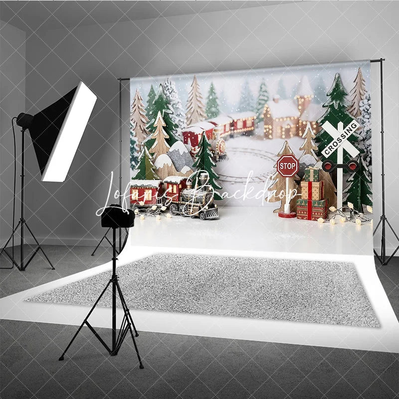 Lofaris Festive Winter Village Holiday Backdrop with Miniature Train Snow Covered Trees and Gift Boxes