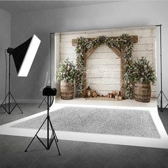 Lofaris Frosted Pine Garland Wooden Arch Holiday Backdrop with Rustic Barrels and Christmas Gifts Winter Festive Decor