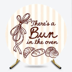 Lofaris Neutral Striped There’s a Bun in the Oven Round Backdrop Baked Goods and Ribbon for Baby Shower Decor.