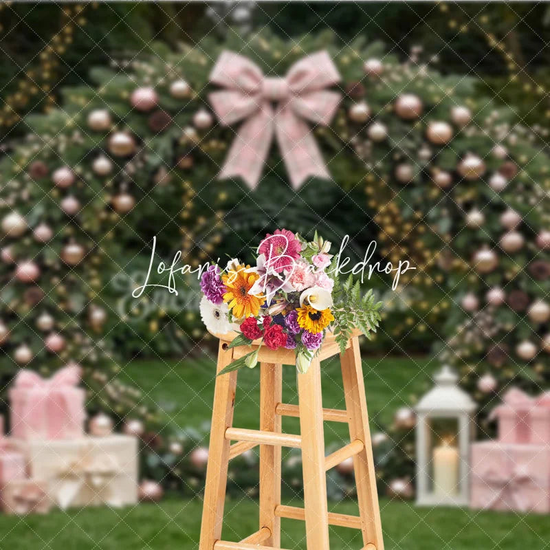 Lofaris Pink and Rose Gold Ornaments Evergreen Wreath Holiday Backdrop featuring a Plaid Bow Gift Boxes with Lanterns