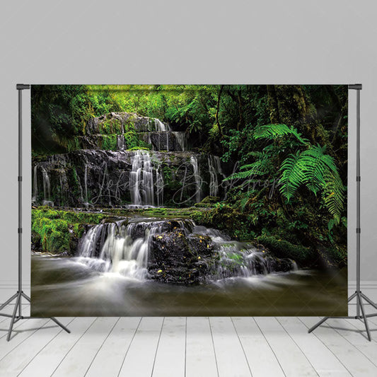 Lofaris Waterfall Scene Luxuriant Green Vegetation Backdrop