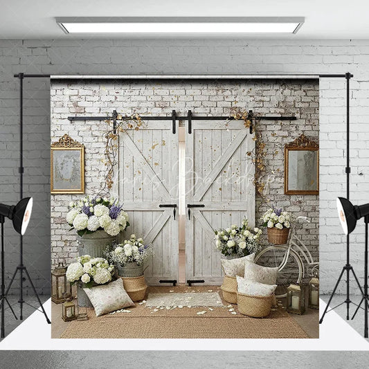 Lofaris White Brick Wall and Rustic Barn Doors Photography Backdrop with Elegant Floral Arrangements Wedding Event Decor